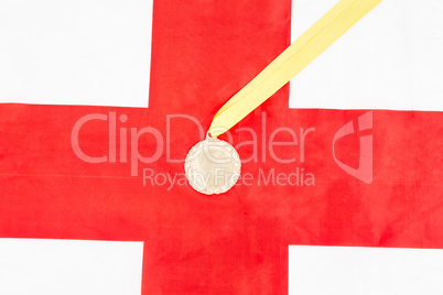 Close-up of gold medal on english flag