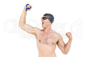 Swimmer posing with gold medal