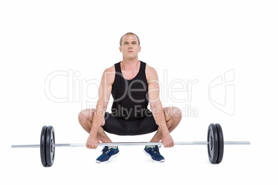 Bodybuilder lifting heavy barbell weights