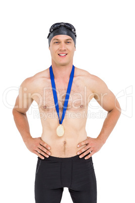 Victories swimmer posing with gold medal around his neck