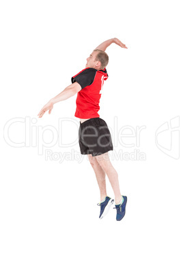 Sportsman hitting volleyball