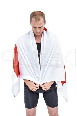 Athlete with england flag wrapped around his body