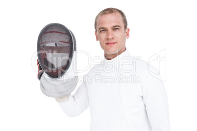 Swordsman holding fencing mask