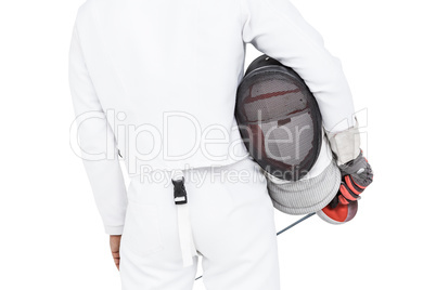 Rear view of swordsman holding fencing mask and sword