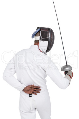 Man wearing fencing suit practicing with sword