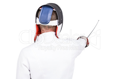 Man wearing fencing suit practicing with sword