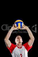 Sportsman throwing volleyball while playing