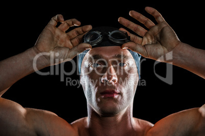 Portrait of swimmer wearing swimming goggles