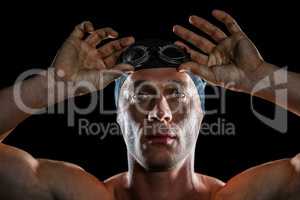 Portrait of swimmer wearing swimming goggles