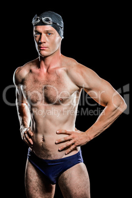 Swimmer standing with hand on hip