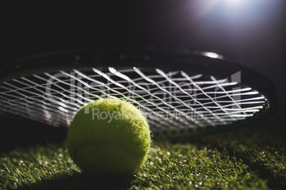 Close up of tennis ball with racket