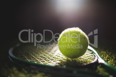 Close up of tennis ball with racket