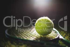 Close up of tennis ball with racket