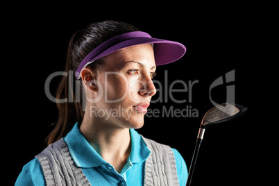 Golf player on black background