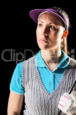 Golf player on black background