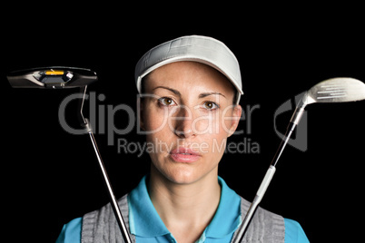 Golf player posing with golf club