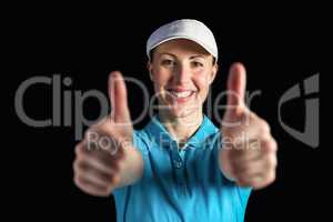 Sportswoman posing on black background