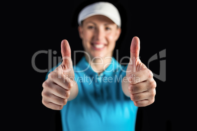 Sportswoman posing on black background