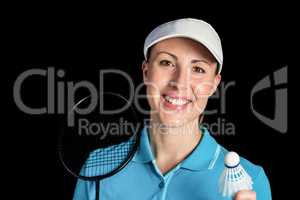 Badminton player holding badminton racket and shuttlecock