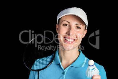 Badminton player holding badminton racket and shuttlecock