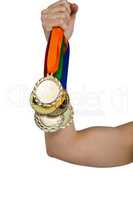 Athlete holding gold medals after victory