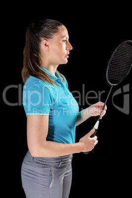 Female athlete holding badminton racket