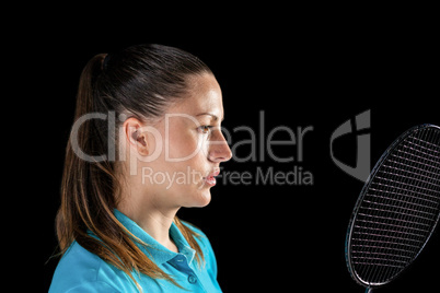 Female athlete holding badminton racket