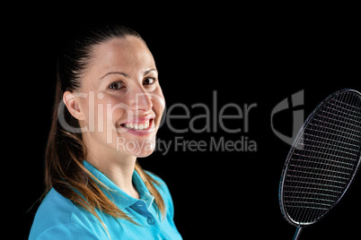 Female athlete holding badminton racket