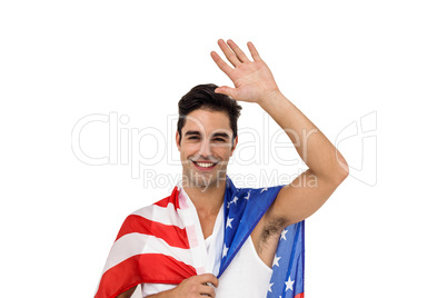 Athlete with american flag wrapped around his body