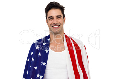 Athlete with american flag wrapped around his body