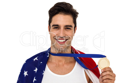 Athlete holding gold medal after victory