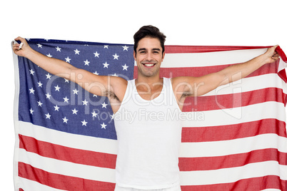 Athlete posing with american flag after victory