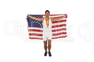 Athlete posing with gold medals after victory