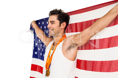 Athlete posing with gold medals after victory