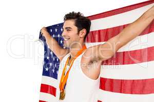 Athlete posing with gold medals after victory