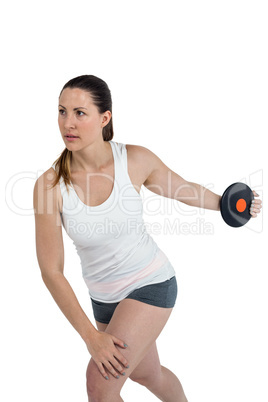 Female athlete playing discus throw on white background