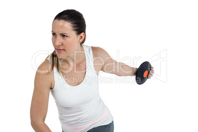 Female athlete playing discus throw on white background