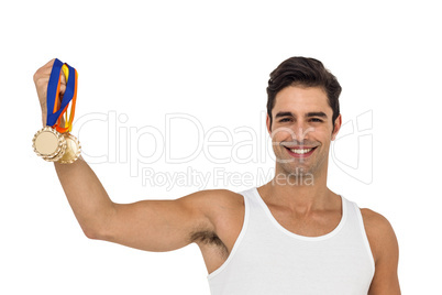 Athlete posing with gold medals on white background
