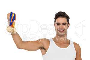 Athlete posing with gold medals on white background