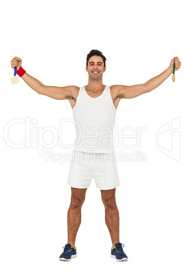 Athlete holding gold medal after victory