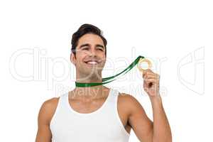 Athlete posing with gold medals around his neck