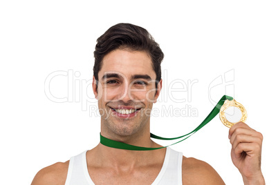 Athlete posing with gold medals around his neck