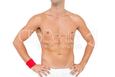 Male athlete standing on white background