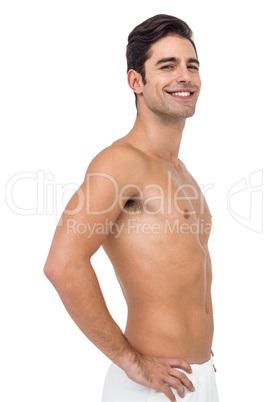 Male athlete standing on white background