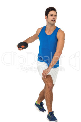 Male athlete playing discus throw on white background