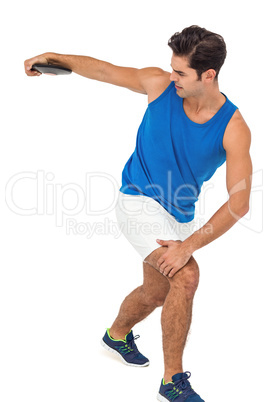 Male athlete playing discus throw on white background