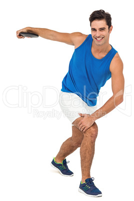 Male athlete playing discus throw on white background