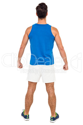 Male athlete standing on white background