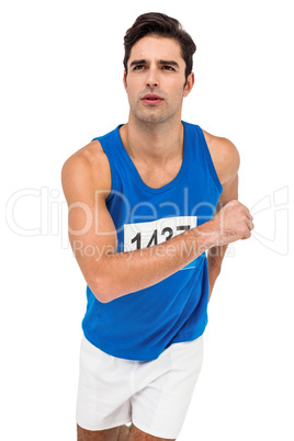 Male athlete running on white background