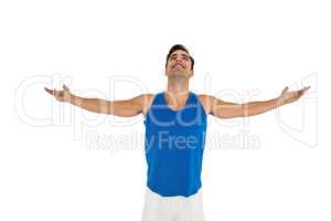 Excited male athlete with arms outstretched